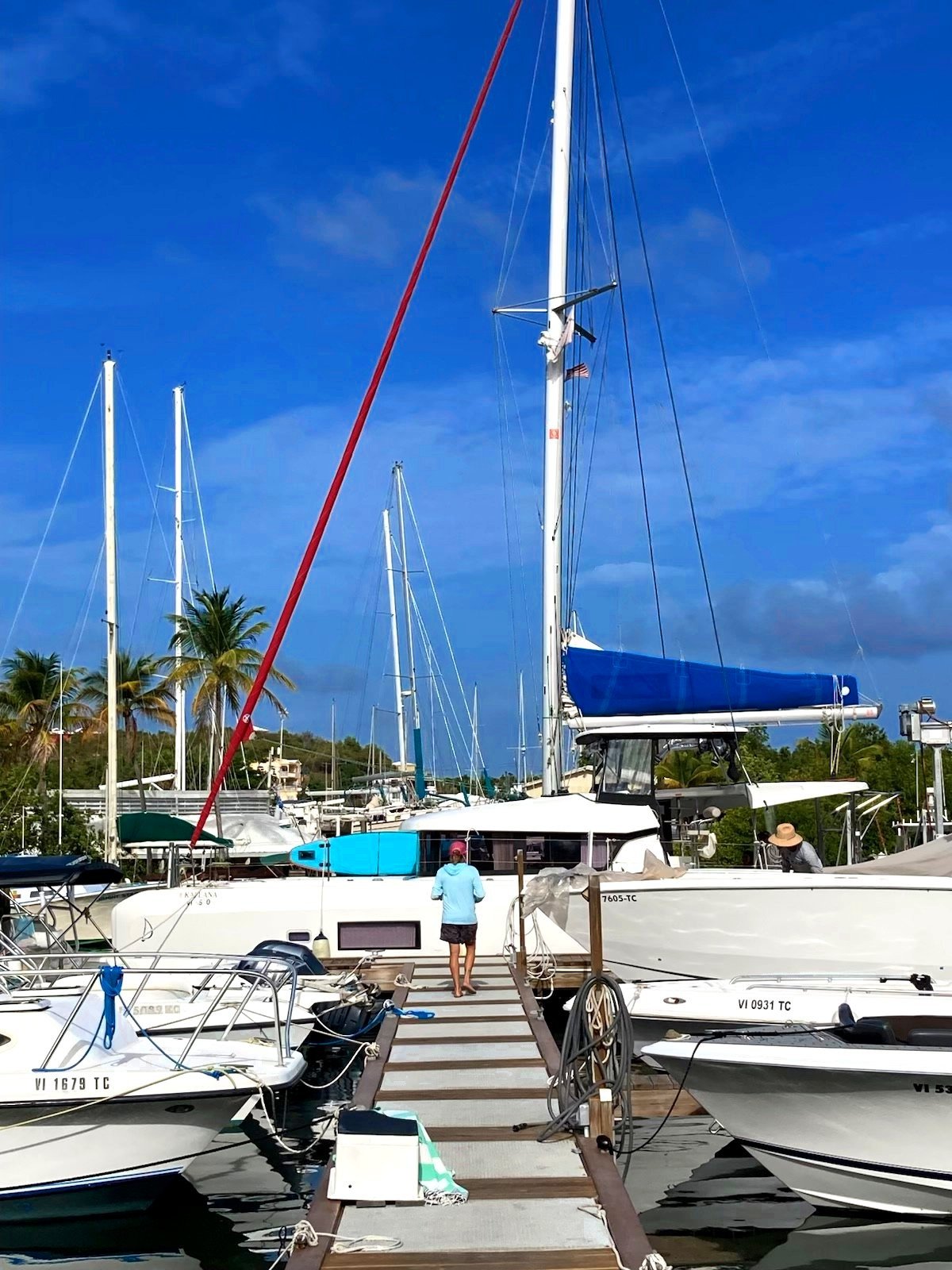 Captain walking the dock at the Charlotte Amalie marina where Endless Blue catamarans are based