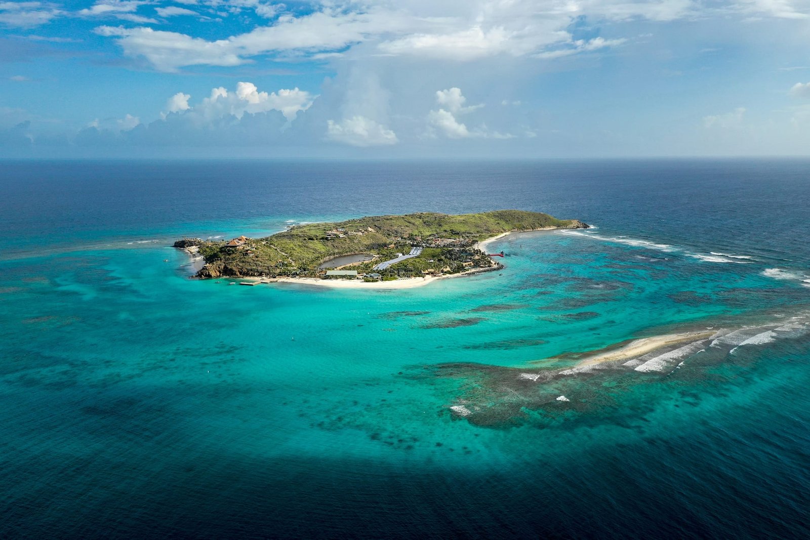 Aerial view of a reef-ringed island surrounded by turquoise water in the British Virgin Islands