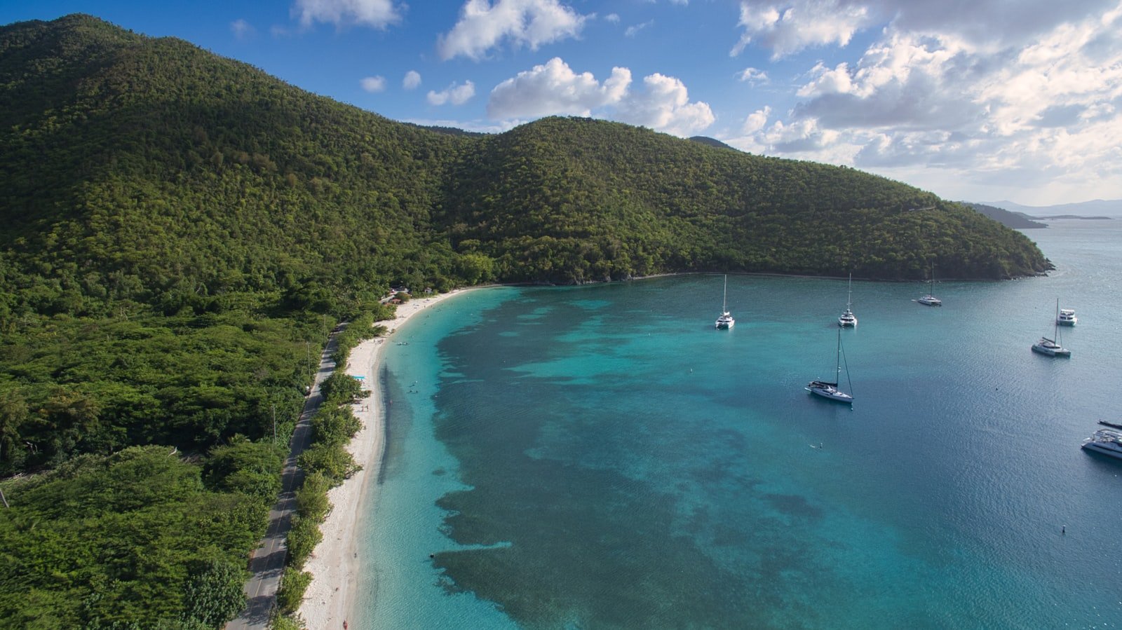 Boats resting at anchor in calm turquoise water, British Virgin Islands