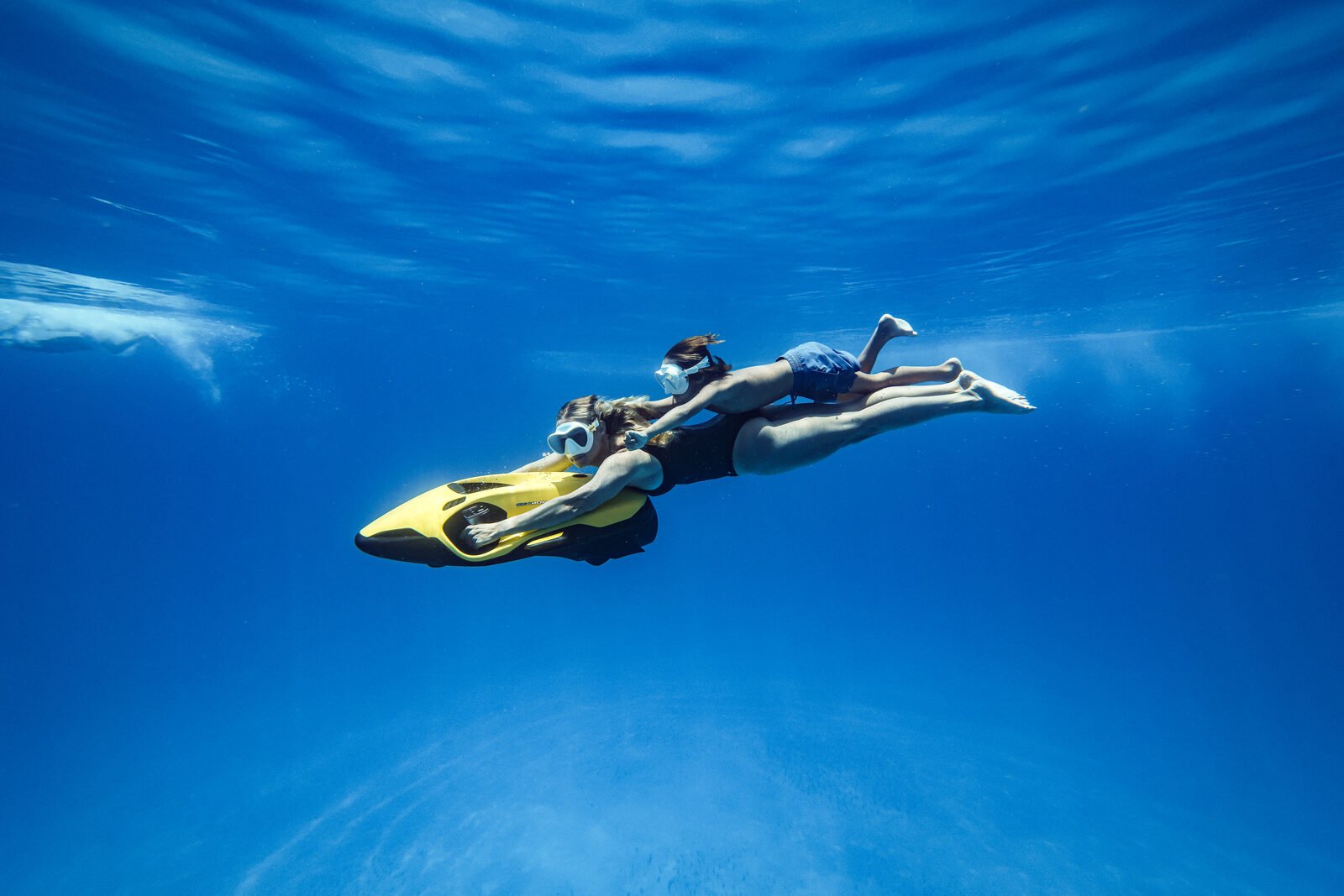 A rider gliding across turquoise Virgin Islands water on a Sea Bob