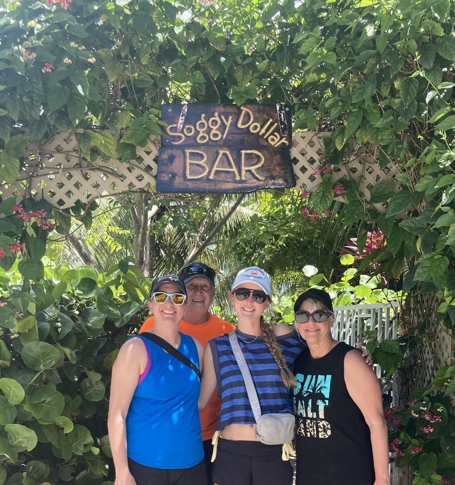Endless Blue guests at the Soggy Dollar Bar sign, White Bay, Jost Van Dyke, BVI